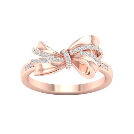 Modern and stylish, this diamond knot ring pairs well with casual attire and party wear. Crafted in 10K rose gold, this ring features a diamond accent ribbon wrapped into a knot. Prong set with round diamonds totalling 0.12Ct TDW, this ring captivates with diamond shimmer and polished metallic lustre. Size: 6. Color: Pink. Gender: female. Age Group: adult. Diamond Knot Ring, Gold Knot Ring, Diamond Knot, Ribbon Ring, Cubic Zirconia Engagement Rings, Bow Ring, Bow Jewelry, Knot Ring, Rose Gold Metal