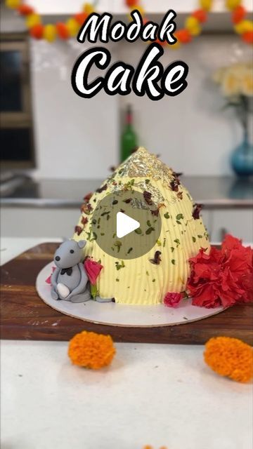 Masterchef Oindrila Bala on Instagram: "This time last year, @sweetboutiquebyaditi and I had so much fun putting together this Jumbo Modak cake for Ganesh Chaturthi 😊  And with the festival almost here again, here’s a little throwback to this Jumbo Modak Cake recipe that perfectly captures the spirit of Ganesh Chaturthi.  The cake is as tasty as it is beautiful ❤️  Give it a try! Here’s how to go about it.  #ganeshchaturthi #modakcake #jumbomodakcake #cakereels #bakingmagic #bakinglove #ganeshfestival #modakrecipe #modaklove #recipereels #cakevideo #indiandelicacy #easymodakrecipes #cakedesigns #uniquecakes #recipeseveryday #cakevideosforbeginners #cakevideosdaily #cakedesigninspirations  [Ganesh chaturthi cake, modak themed cake, modak flavoured cake, jumbo modak cake, Ganesh chaturthi s Modak Recipe, Cake Videos, Unique Cakes, How To Go, Ganesh Chaturthi, The Festival, Themed Cakes, Cake Recipe, Cake Designs