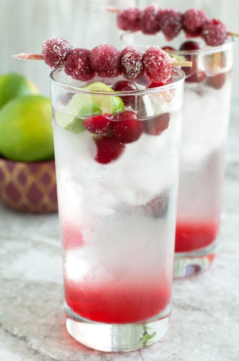 Welcome the holidays with this sparkling cranberry lime mocktail. Full of bubbles and a hint of lime and cranberry, this mocktail is sure to please your holiday guests. Cocktails With Cranberry Juice, Hillshire Snacking, Boozy Punch, Cranberries Recipes, Cranberry Mocktail, Cranberry Fizz, Cranberry Lemonade, Drink Night, Cranberry Simple Syrup