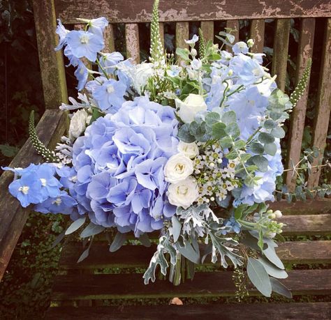 Blue Jumbo Hydrangea, Blue Delphinium, Blue Tweedia, White Roses, White Waxflower, Lace Leaf Dusty Miller, Green Seeded Eucalyptus Wedding Bouquet Wedding Bouquets Blue, White Waxflower, Blue Tweedia, Wedding Games For Kids, Wedding Card Wordings, Delphinium Blue, Blue Hydrangea Wedding, Eucalyptus Wedding Bouquet, Wine Wedding Favors