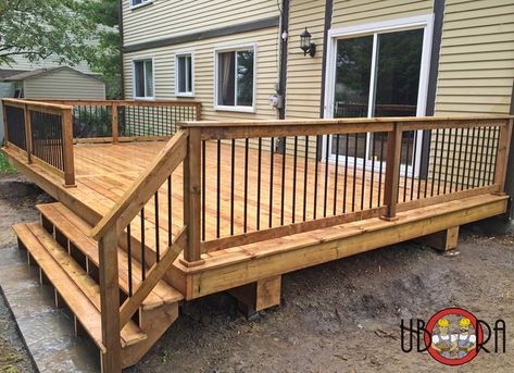 Types of deck spindles Wood Deck Metal Railing, Decks With Black Spindles, Types Of Deck Railings, Black Railing Deck, Black Porch Railing Ideas, Deck Railing Height, Lakeside Landscaping, Backyard Lounge, Deck Rails