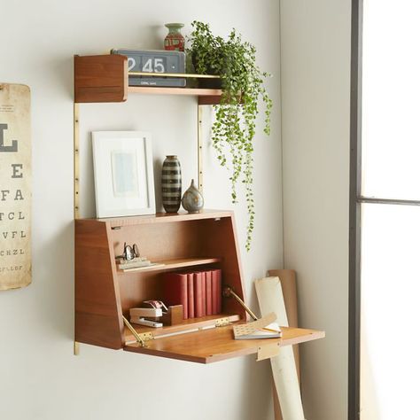 16 Wall Desk Ideas That Are Great For Small Spaces // The door of this shelving unit opens up to become the perfect writing surface that can also hide things when you close it up. Fold Down Desk, Small Workspace, Apartment Storage, Office Shelving, Desks For Small Spaces, Bedroom Desk, Small Space Storage, Wall Desk, Small Space Diy