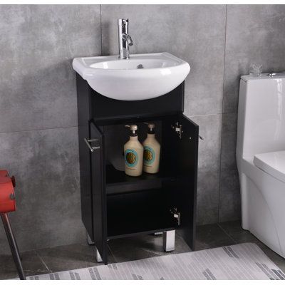 This 18" single sink vanity set is suitable for small space bathrooms but with ample storage with an adjustable shelf on the side of the base. It's freestanding and made of MDF with a water-proofed painting surface finish. Metal Legs have adjustable screws to make sure the cabinet can be stable and sturdy after installation. Two soft-closing doors with two brushed nickel handles. Integrated ceramic sink with top is easy to clean and anti-scratch. The mirror with the frame is the same color as th Small Bathroom Vanity Ideas, Laundry Combo, Small Full Bathroom, Small Bathroom Sinks, Small Space Bathroom, Small Bathroom Vanities, Vanity Set With Mirror, Hall Bathroom, Single Sink Vanity