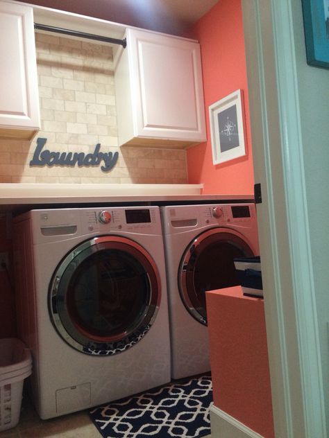 Coral laundry room Coral Cabinets Bathroom, Coral Laundry Room Ideas, Coral And Green Bathroom, Coral Accent Wall Bathroom, Coral Laundry Room, Mint And Coral Bathroom, Sherwin Williams Coral Perfection, Laundry Bathroom Combo, Pink Laundry Rooms