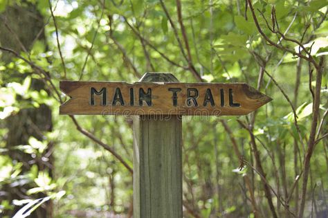 Wooden Sign Showing Main Trail Direction With Words And Arrow. Stock Photo - Image: 70561660 Diy Trail Signs, This Way Sign Arrow, Trail Signs Diy, Nature Trail Signs, Sick Mind, Backyard Treehouse, Trail Markers, Retreat Centre, Arrow Wood Sign