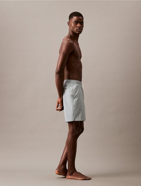 Made with solid styling, these swim shorts are made with quick-dry fabric perfect for the sand and the sun. Detailed with a drawstring elasticated waistband, a signature Calvin Klein logo and a 7" inseam. Male Poses Reference Photography, Gesture Practice, Static Poses, Poses Male, People References, Ck Logo, Male Pose Reference, Gesture Drawing, A Signature