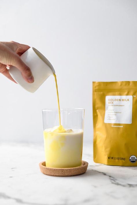 Have you tried a golden milk latte yet? Served over ice it’s all the rage this summer. From antioxidants and anti-inflammatory benefits, turmeric is a superfood you’re going to love. #goldenmilk #goldenlatte Iced Golden Milk, Milk Branding, Benefits Turmeric, Golden Latte, Turmeric Golden Milk, Golden Milk Latte, Real Food Snacks, Gold Milk, Turmeric Latte