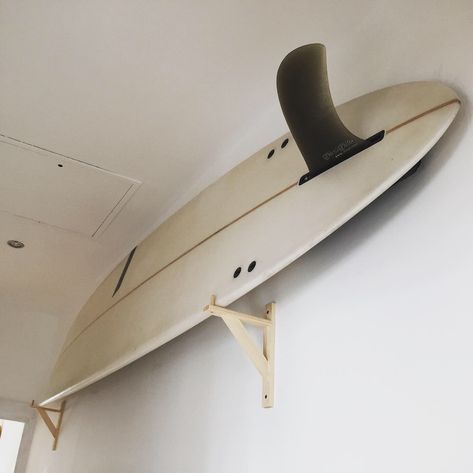 DIY surfboard wall mount Surfboard Mounted On Wall, Surf Board Wall Mount, Hanging Surfboard On Wall, Surfboard Wall Mount, Surf Board On Wall, Surfboard On Wall, Surfboard Rack Wall, Surfboard Mount, Surf Storage