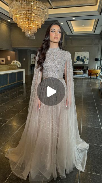 Iyza Belaar on Instagram: "#fitcheck in the Noor Modest Long Drape Sleeves Beaded A-line Gown ✨💎 Experience understated elegance with the Noor Modest Long Drape Sleeves Beaded A-line Gown by Iyza Belaar. This evening gown features a unique blend of modesty and glamour, with long cape sleeves gracefully touching the floor and a delicate beaded bodice that seamlessly transitions into a tulle beaded skirt. Hand-embellished with meticulous attention to detail, this gown is a captivating choice for those seeking timeless sophistication at formal events. #modestfashion #modest #longsleeve #longsleevedress #modesteveninggown #modesteveningdress #habibidress #afghan #arabdress #abayafashion #muslimdress #customdress #arabwedding #fashion #dressesonline #dresses #weship #instashop #onlineshopping Modest Evening Gowns, Arab Dress, Modest Evening Dress, Long Drapes, Long Cape, Beaded Skirt, Muslim Dress, Drape Sleeves, Cape Sleeves