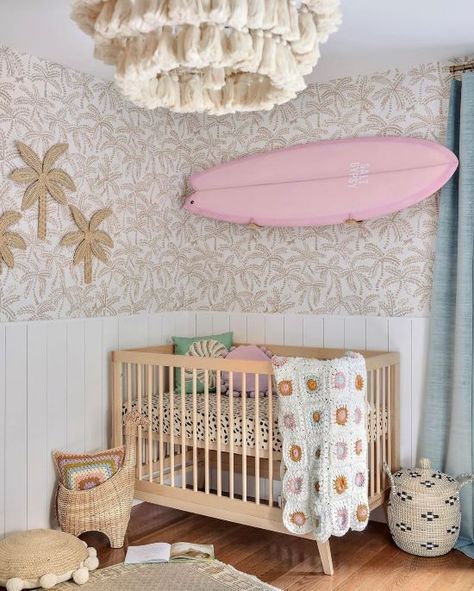 Cute girly baby nursery with a pink surf board Beachy Themed Nursery, Beach Inspired Nursery, Boho Beach Nursery Girl, Pink Beach Nursery, Pink Coastal Nursery, Ocean Theme Nursery Girl, Beach Nursery Girl, Cute Baby Rooms, Unique Girl Nursery