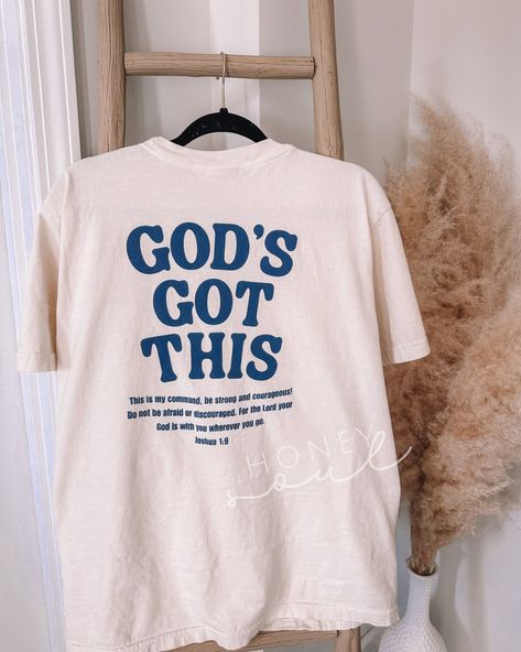 God's Got This Graphic Tshirt Sizing: Unisex (see size guide in photos for measurements) Color: Ivory or White Material: 100% Cotton Brand: Comfort Colors  Design as shown on the front left pocket & back  *cannot be personalized or changed* PROCESSING/TURNAROUND TIME: -Processing/Turn around times may vary. Please check the estimated ship/delivery times.  -Processing/Turn around time DOES NOT include shipping time. christian topsChristianfaith apparelTrendy TopsIn stylewalk by faithEncouragement Cute Christian Tshirt, Christian Gift Shop, Christian Concert, Christian Clothes, Christian Tee Shirts, Christian Graphic Tees, Christian Shirts Designs, Christian Tshirt, Christian Fashion