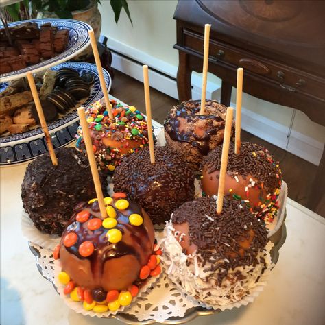 Caramel apples Caramel Apples Aesthetic, Apple Covered In Caramel, Caramel Apple Fall Aesthetic, Halloween Carmel Apple, Caramel Apple, Chocolate Caramel Pretzel Apple, Carmel Apple Gourmet, Winter Bucket List, Chocolate Drizzle