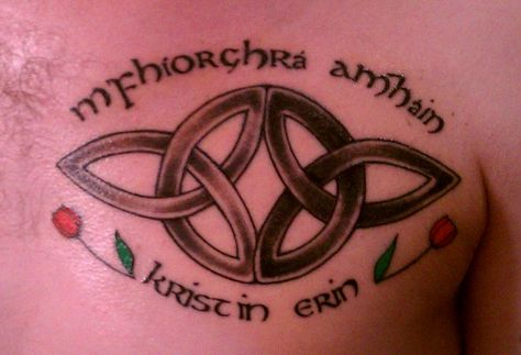 Celtic Tattoo - Serch Bythol Symbol meaning Everlasting Love (Two trinity knots symbolizing body, mind and spirt of each of two becoming one, forming an endless circle, like a wedding ring) with "My One True Love" written in Gaelic (m'fhíorghrá amháin) & Orange Tulips for my Wedding Bouquet and other special meaning for us - Tattooed over his heart for 13th Wedding Anniversary & 18 Years Together Infinity Knot Tattoo, Couple Name Tattoos, Symbols Tattoos, Anchor Symbol, Trinity Knot Tattoo, Love Symbol Tattoos, Celtic Knot Tattoo, Irish Tattoos, Tattoos With Kids Names