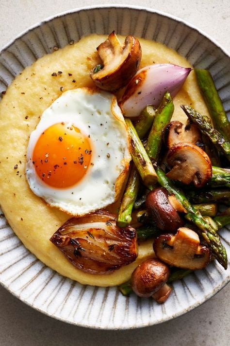 You really can't beat creamy polenta with a fried egg on top—unless you add some roasted veggies, as we've done in this hearty and healthy meal in a bowl. Serve these bowls for a satisfying brunch, lunch or dinner that comes together in just 30 minutes. #dinner #supper #dinnerideas #supperideas #dinnerrecipes #supperrecipes #healthydinnerideas #healthysupperideas #healthydinnerrecipes #healthysupperrecipes #recipe #eatingwell #healthy Polenta Bowls, Meal In A Bowl, Creamy Polenta, Overnight Oat, Healthy Supper Recipes, Healthy Supper, Fried Eggs, Supper Recipes, Fried Vegetables