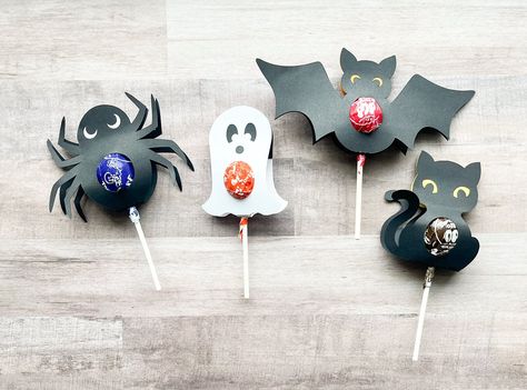 "Say \"Happy Halloween\" with this treat!  These lollipop holders fit a standard size lollipop and are so cute for classroom treats or to hand out to coworkers and trick-or-treaters!  These are available in 4 different shapes or a variety set - you choose! Some assembly required.  Lollipops are NOT included. Each lollipop holder is made from construction paper and includes double-sided tape.  Simple slide your lollipop into the hole, peel the tape, close it up and stick it shut. So easy and cute Halloween Lollipop Holders, Halloween Treat Holders, Halloween Food Crafts, Craft Holder, Halloween Lollipop, Office Halloween Decorations, Lollipop Holder, Fun Halloween Treats, Halloween Wood Crafts