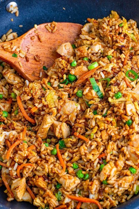 Learn how to make restaurant-quality chicken fried rice at home with just a few simple everyday ingredients. Tender chicken in each bite paired with fried rice, veggies, and tender eggs all seasoned perfectly. This easy chicken fried rice will instantly become a family favorite that even picky eaters will gobble up. Try this recipe for an easy weeknight lunch or dinner. Try it today! Chicken And Prawn Fried Rice, Fried Rice Aesthetic, Egg Fried Rice Recipe Easy, Rice Recipes Easy, Rice Aesthetic, Fried Rice Egg, Homemade Chicken Fried Rice, Easy Egg Fried Rice, Chinese Egg Fried Rice