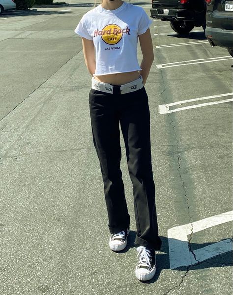 Girl wearing Hard Rock Cafe top with 474 dickies and sneakers. Cute pose, cute skater style outfit Dickies Loose Fit Pants Outfit, Dickies Scrubs Outfit, Dickies Jeans Outfits Women, Womens Dickies Outfit, Blue Dickies Pants Outfit, Women Dickies Outfit, Dickies Pants Outfits Aesthetic, Grey Dickies Outfit, Dickies 874 Outfit Girl