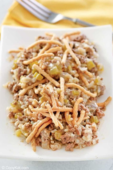 American Chop Suey is a classic comfort food dish with simple ingredients. It’s a hearty meal of ground beef, mushrooms, and rice in a creamy sauce topped with crunchy chow mein noodles. Get the easy recipe and find out how to make the best American chop suey with rice for dinner. This hamburger casserole is also known as American Goulash. #americanchopsuey #chopsuey #comfortfoodrecipes #groundbeefrecipes #casserolerecipeseasy #ricerecipesfordinner Hamburger And Rice Recipes, Pork Chop Suey, Mushrooms And Rice, Ground Beef Mushrooms, Rice For Dinner, American Chop Suey, Beef Chow Mein, Hotdish Recipes, American Goulash