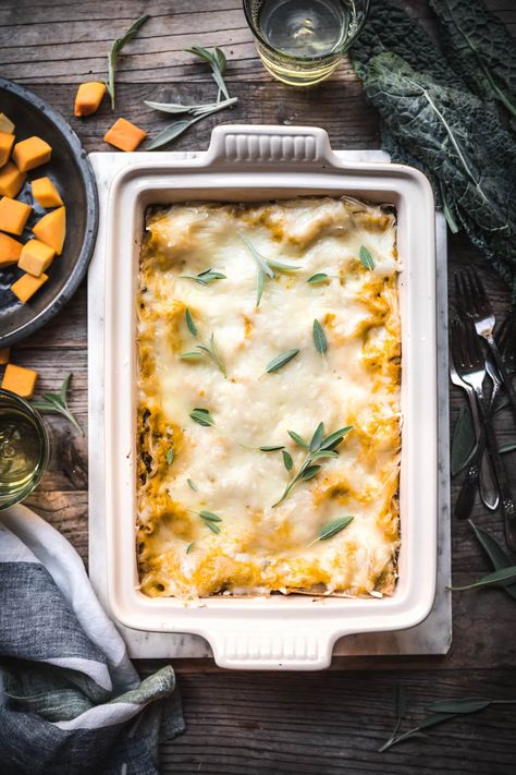 vegan butternut squash lasagna with mushrooms and kale in a casserole dish