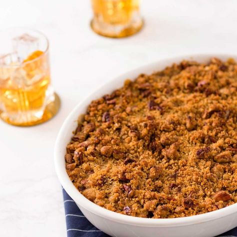 This Buttery Bourbon Sweet Potato Casserole Recipe Is the Missing Piece in Your Holiday Feast - Brit + Co Sweet Potato Casserole With Bourbon, Paleo Sweet Potato Recipes, Gluten Free Sweet Potato Casserole, Paleo Sweet Potato Casserole, Paleo Veggies, Vegetarian Casserole Recipes, Paleo Thanksgiving Recipes, Bourbon Sweet Potatoes, Pecan Crumble