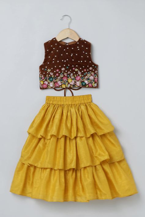 Shop for this happy collection of Yellow Velvet Embroidered Floral Top And Layered Skirt Set For Girls by Byb Premium online at Aza Fashions. Skirt And Top Indian, Indian Dresses For Kids, Crop Tops For Kids, Cotton Frocks For Kids, Frocks For Kids, Kids Party Wear Dresses, Kids Dress Collection, New Saree Blouse Designs