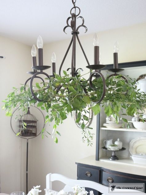 Adding Holiday Greenery to Simple Chandeliers - The Crowned Goat Chandelier With Greenery, How To Decorate A Chandelier, Chandelier Greenery, Decorating Chandeliers, Boho Garden Party, Simple Chandelier, Vintage Wedding Table, Outdoor Chandelier, Outdoor Chandeliers