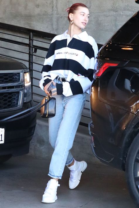 Hailey Baldwin’s Street Style: Backless Top, Futuristic Sneakers – Footwear News Polo Shirt Outfit Women's Street Style, Polo Street Style, Polo Top Outfit, Polo Dress Outfit, Futuristic Sneakers, Alexander Wang Top, Polo Shirt Outfits, Polo Outfit, Top Jeans