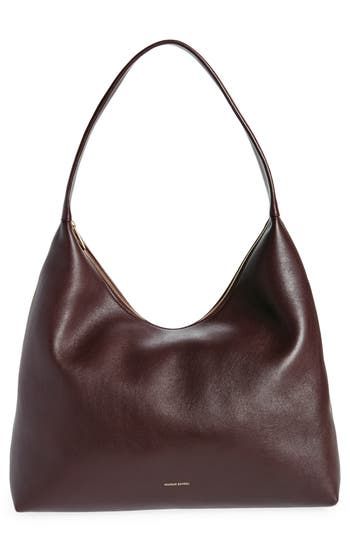 Slouchy and spacious, this oversized hobo bag is made in Italy from soft, grained leather with a supple suede lining and simple shoulder strap. Top zip closure Shoulder strap Calfskin-suede lining Leather Made in Italy Designer Handbags Oversized Crossbody Bag, Slouchy Shoulder Bag, Clothes And Where To Buy Them, Leather Shoulder Bag Outfit, Simple Purses, Cute Shoulder Bags, Brown Suede Bag, Simple Leather Bag, Suede Hobo Bag