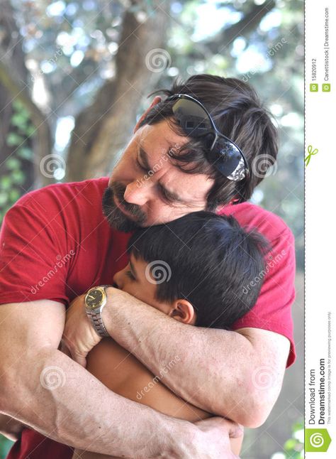 A father is hugging his child, comforting him. Comfortable Poses Reference, Hugging Tightly Reference, Protective Hug Reference, Hug Reference Photography, Parent Child Poses, Pose Reference Muscular, Embrace Reference, Parent And Child Drawing Reference Poses, Dad Holding Daughter