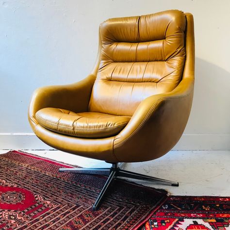 Mid-Century Style Swivel Lounge Chair | Shophousingworks Mid Century Swivel Chair, Cognac Leather Swivel Chair, Midcentury Recliner Chairs, Orange Mid Century Chair, Cooper Mid-century Leather Swivel Office Chair, Leather Accent Chair, Upholstery Foam, Swivel Armchair, Egg Chair