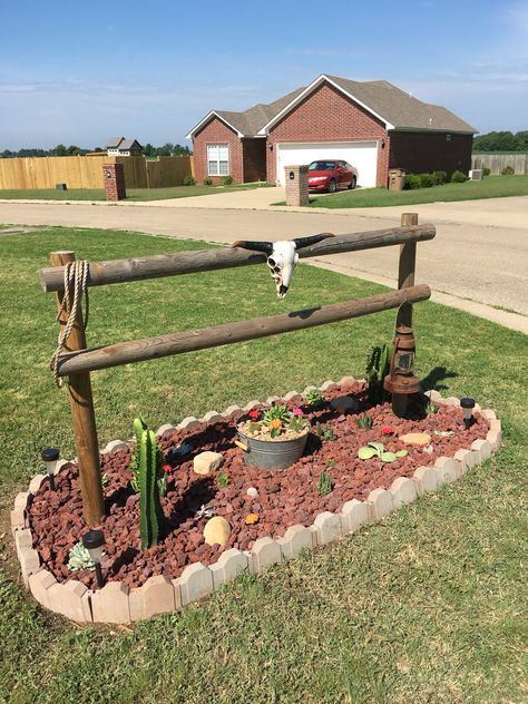 My take on the hitching post idea. I showed it with cacti which is about the only thing I can't kill, lol. The skull was an afterthought which made it better. All my neighbors love it as well. Driveway Entrance Landscaping, Country Western Decor, Rustic Landscaping, Hitching Post, Backyard Garden Landscape, Front Yard Garden Design, Front Landscaping, Garden Yard Ideas, Outdoor Decor Backyard