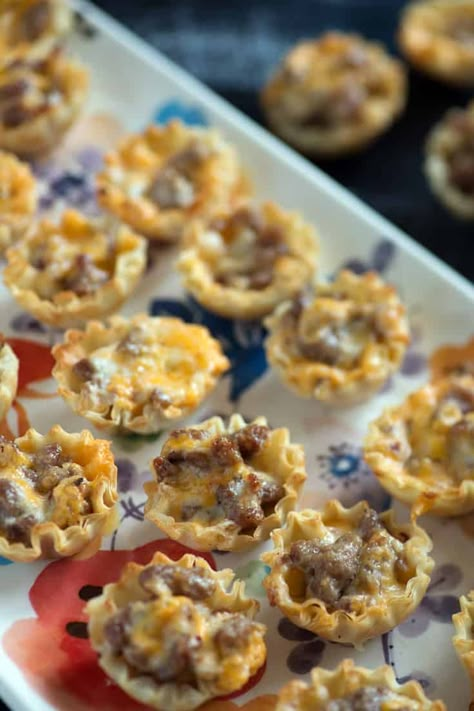 Sausage phyllo cups are a simple 4 ingredient appetizer that you can prepare in 10 minutes.  Simple doesn't mean they're not amazing. Great for game days or any occasion. #appetizer #phyllo #fingerfoods #butterandbaggage Sausage Ranch Phyllo Cups, Philo Cup Recipes, Sausage Appetizers Finger Foods, Phillo Puff Pastry Cups, Philo Cups Appetizers Appetizer Recipes, Philo Cup Appetizers, Sausage Phyllo Cups, Sausage Phyllo, Phyllo Cup Appetizers