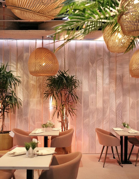 Pretty pink casual dining restaurant. Interior design with soft pink, pastel, calming and inviting decor. Tropical plants and bohemian vibes. Woven pendant lights. Palms. Tropical. Pastel Restaurant, Dining Restaurant Interior, Interior Design Tropical, Pink Restaurant, Bar Interior Design, Dining Restaurant, Casual Dining Restaurant, Bohemian Vibes, Bar Interior