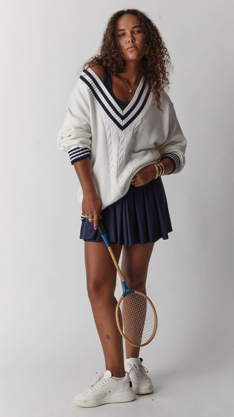 Tennis fashion has a timeless appeal, open to re-interpretation.    Shop the look → The Louie Knit Sweater and Peached Lucette Tennis Dress in Navy. Tennis Sweater Women, Tennis Sweater Outfit, Tennis Dress Outfit Fashion, Sporty Preppy Outfits, Mens Gym Wear, Tennis Dress Outfit, Fashionable Sportswear, Tennis Open, Tennis Mom