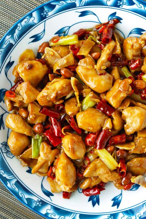 Kung Pao Chicken is a popular Sichuan chicken stir-fry that’s quick and easy to make on any given weeknight and full of irresistible savory, spicy, numbing flavors with a hint of tang and crunchy peanuts. Learn how to make it at home the authentic Chengdu-style way! #kungpaochicken #gongbaojiding #sichuan #spicy #stirfry #dinner #chicken #quickandeasy #asianfood #chinese food #authenticrecipe | That Spicy Chick Authentic Kung Pao Chicken Recipe, Sichuan Chicken, Asian Stir Fry Recipe, Cut Recipe In Half, Szechuan Recipes, Kung Pao Chicken Recipe, Cut Recipe, Asian Stir Fry, Healthy Party Food