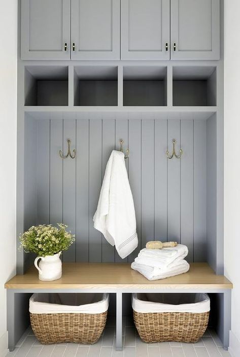 Lined baskets sit beneath a maple mudroom bench fixed against vertical gray shiplap trim under brass hooks mounted beneath cubbies fixed under gray cabinets. Cottage Style Mudroom, Beadboard Trim, Shiplap Trim, Mudroom Addition, Gray Shiplap, Transitional Laundry Room, Bria Hammel Interiors, Bria Hammel, Mudroom Cabinets