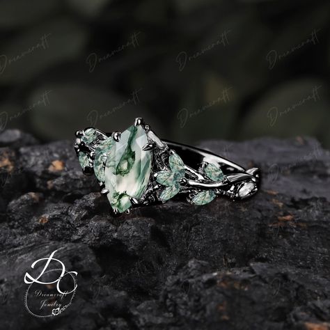 Gothic Black Gold Marquise Cut Moss Aagate Engagement Ring Nature Inspired Cluster Promise Ring  Art Deco Leaf Gemstone Branch Bridal Ring --->Ring details: - Theme:Romantic Wedding & Engagement - comfortable band - Metal :The underneath metal is in Silver/ 10K/14K/18K white gold, coated with black rhodium - Center Stone : Moss agate - Carat: 5*10mm - Side stone : moss agate  +  moissanite - Side stone:0.48ctw - wedding band :  moss agate+moissanite+lab opal - 0.12ctw  Materials: - 14k rose gold Nature Theme Engagement Ring, Engagement Ring Nature Inspired, Labradorite Rings Engagement, Witchy Engagement Ring Silver, Mossy Agate Engagement Ring, Black Moss Agate Ring, Silver Nature-inspired Crystal Wedding Ring, Moss Agate Wedding Ring Silver, Gothic Rings Engagement