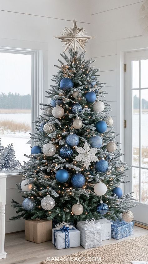 Discover 21+ gorgeous Christmas tree ideas for 2024 to make your home sparkle this season! Create a timeless look with classic red and green decor or opt for a chic vibe with silver, gold, or rose gold ornaments. For a cozy feel, try a rustic farmhouse theme featuring burlap ribbons and wooden accents. #ChristmasTreeDecor #HolidayTreeIdeas #Christmas2024Decor #FestiveTreeInspo Christmas Tree Color Schemes Blue, White Silver And Blue Christmas Tree, Christmas Tree Ideas Light Blue, Blue Silver And Gold Christmas Tree, Christmas Tree Ideas Blue And Silver, Themed Christmas Tree Ideas Color Schemes, Blue Themed Christmas Tree, Gold And Blue Christmas Tree, Christmas Tree Ideas Blue