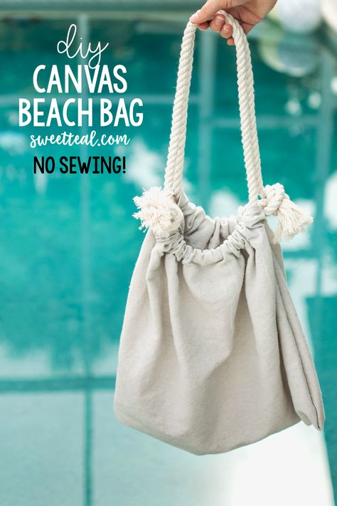 Make this bag in less than 10 minutes without any sewing!! It's the easiest beach bag you'll ever make! It's nautical too with the canvas drop cloth and cotton rope. Diy Beach Bag, Diy Bags No Sew, Canvas Drop Cloths, Diy Clothes Refashion, Canvas Beach Bag, Beach Fabric, Canvas Diy, Diy Bags Purses, Tote Bags Sewing