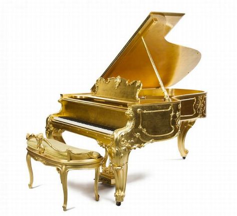 This particular piano was designed as part of the 50th anniversary celebration of the company. It is a 1904 Model B piano with a serial number serial number 108815, and was designed by Joseph Burr Tiffany who was the head artist of Steinway’s Art Case Department. He also happened to be related to the founder of Tiffany & Company. It was then carved by Juan Ayuso from solid mahogany and covered with gold. Several other pianos were crafted for this special anniversary collection. Gold Piano, Group Piano Lessons, 50th Anniversary Celebration, Luxury Home Furniture, Art Case, Grand Piano, Piano Lessons, Music Love, Art Auction