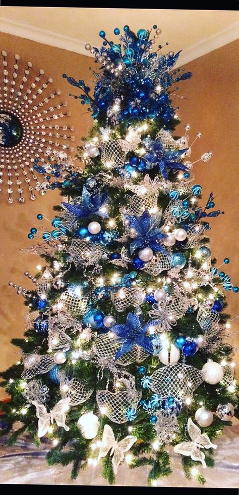 Blue and silver Christmas tree Blue And Silver Christmas Tree, Blue And Silver Christmas, Silver Christmas Tree Decorations, Blue Christmas Tree Decorations, Blue Christmas Decor, Silver Christmas Decorations, Blue Christmas Tree, Silver Christmas Tree, Black Christmas Trees