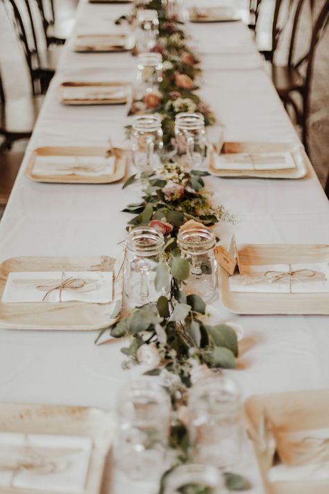 This centerpiece was so simple and put together so well. We loved how elegant it was!   Photography - @alexmari_ Florals - @urbanflora_va  #greenery #barnwedding #rvaweddings #southern wedding #venue #elegant #bambooplates #masonjars Bamboo Plate Wedding Place Settings, Simple Boho Wedding Table Setting, Sustainable Dinner Party, Bamboo Table Setting Wedding, Neutral Backyard Wedding, Bamboo Table Setting, Palm Plates Wedding, Cheap Wedding Place Settings, Wedding Bamboo Plates