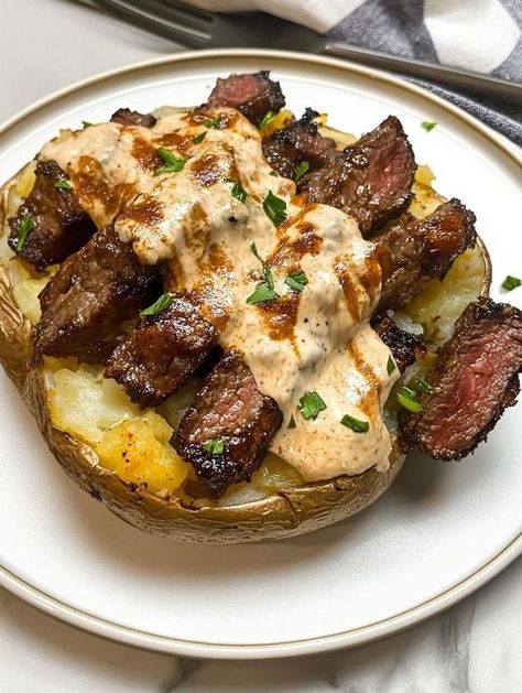 Loaded Baked Potato With Steak, Baked Potato With Steak, Steak Bites Recipe, Creamy Parmesan Sauce, Loaded Baked Potato, Garlic Butter Steak, Loaded Baked Potatoes, Steak Bites, Russet Potatoes