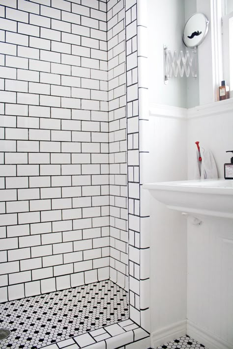 Hope this is what we could do after we remove our ugly acrylic tub. Fantastic tile job - white tiles, black grout.  From: Eric's Stylish, Sunshine-Filled House; Apartment Therapy Dark Grout, Black Grout, Subway Tiles Bathroom, White Bathroom Tiles, White Subway Tiles, Black And White Tiles, Bathroom Shower Tile, White Subway Tile, White Shower