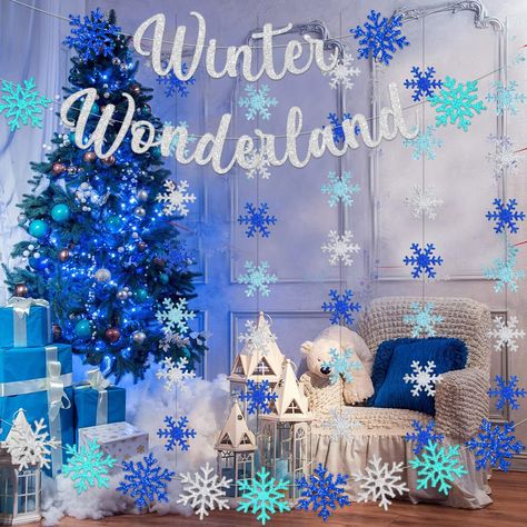 PRICES MAY VARY. ❄Wonderland Snowflake Decorations PACKAGE INCLUDES:1pack of big glitter blue silver snowflake garlands with WINTER WONDERLAND letters;2PCS small bue silver glitter Snowflak hanging garlands,each string includes 21pcs snowflakes.long about 7.8ft. These iridescent winter wonderland decorations are perfect for frozen theme party, winter party, Christmas/inter Party Wonderland party decorations Frozen Theme Party birthday Winter Wonderland Decorations . ❄【Winter Theme Party Decor】 T Icecicles Decorations, Christmas Decor Snowflakes, Winter Wonderland Window Display, Winter Wonderland Classroom Decorations, Winter Wonderland Party Theme Decor, Elsa Decorations Frozen Theme, Winter Wonderland Theme Decorations, Office Christmas Decorations Cubicles, Winter Wonderland Christmas Decorations