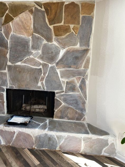 Living Room Transformation Stage 4: Whitewashing the Stone Fireplace - Curious and Cozy Flagstone Fireplace Living Room, Painted Slate Fireplace, Staged Fireplace, Grey Wash Stone Fireplace, Painted Stone Fireplace Before And After, White Washed Stone Fireplace, Lava Rock Fireplace, Whitewash Stone Fireplace, Faux Stone Fireplaces