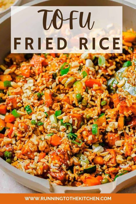 Indulge in the flavors of takeout right from your kitchen with this delectable tofu fried rice recipe! Perfect for a healthy and satisfying meal, this recipe features marinated tofu with crave-worthy crispy edges, mixed with a blend of fresh or frozen veggies like peas, carrots, and zucchini. It's adaptable to your taste and what's in your fridge. Ideal for both vegans and omnivores, this dish can be customized with various proteins and vegetables. Tofu Fried Rice, Carrots And Zucchini, Tofu Fried, Vegetarian Fried Rice, Marinated Tofu, Frozen Veggies, Quick Weeknight Dinners, Fried Rice Recipe, Tofu Recipes