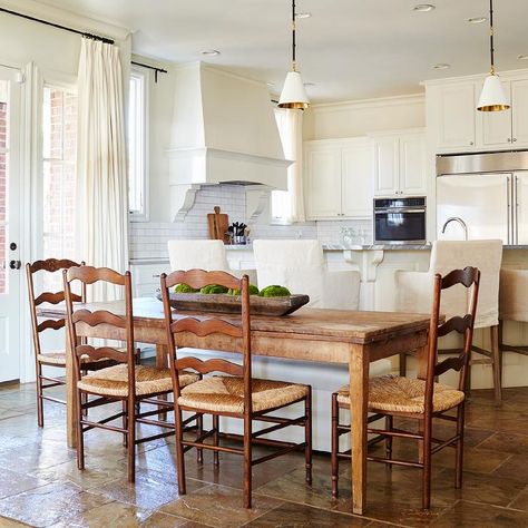 Cottage dining room features a rustic wooden dining table with ladder back chairs and a white storage dining bench. Ashley Gilbreath Interiors, Ashley Gilbreath, Light Wood Dining Table, Top Kitchen Designs, Hgtv Kitchens, Breakfast Rooms, Kitchen Design Styles, Cottage Dining Rooms, Chairs Dining Room