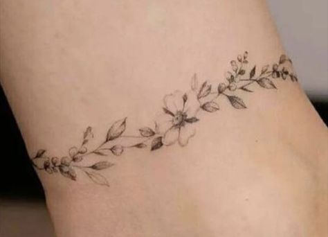 Wild Daisies Tattoo, Sunflower Wrist Wrap Tattoo, Daisy Crown Tattoo, Fine Line Daisy Chain Tattoo, Flower Crown Tattoo Ideas, Poppy Vine Tattoo, Floral Anklet Tattoo, Sunflower And Poppy Tattoo, Daisy Vine Tattoo