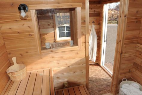 Cedar tongue and groove is used throughout this sauna. The "candle window" is an extra feature that Glenn Auerbach, an outdoor sauna builder who operates SaunaTimes.com, says can create a feeling of openness in an outdoor sauna. Sauna Door, Cedar Tongue And Groove, Building A Sauna, Cedar Paneling, Upper Michigan, Portable Sauna, Backyard Buildings, Finnish Sauna, Sauna Design